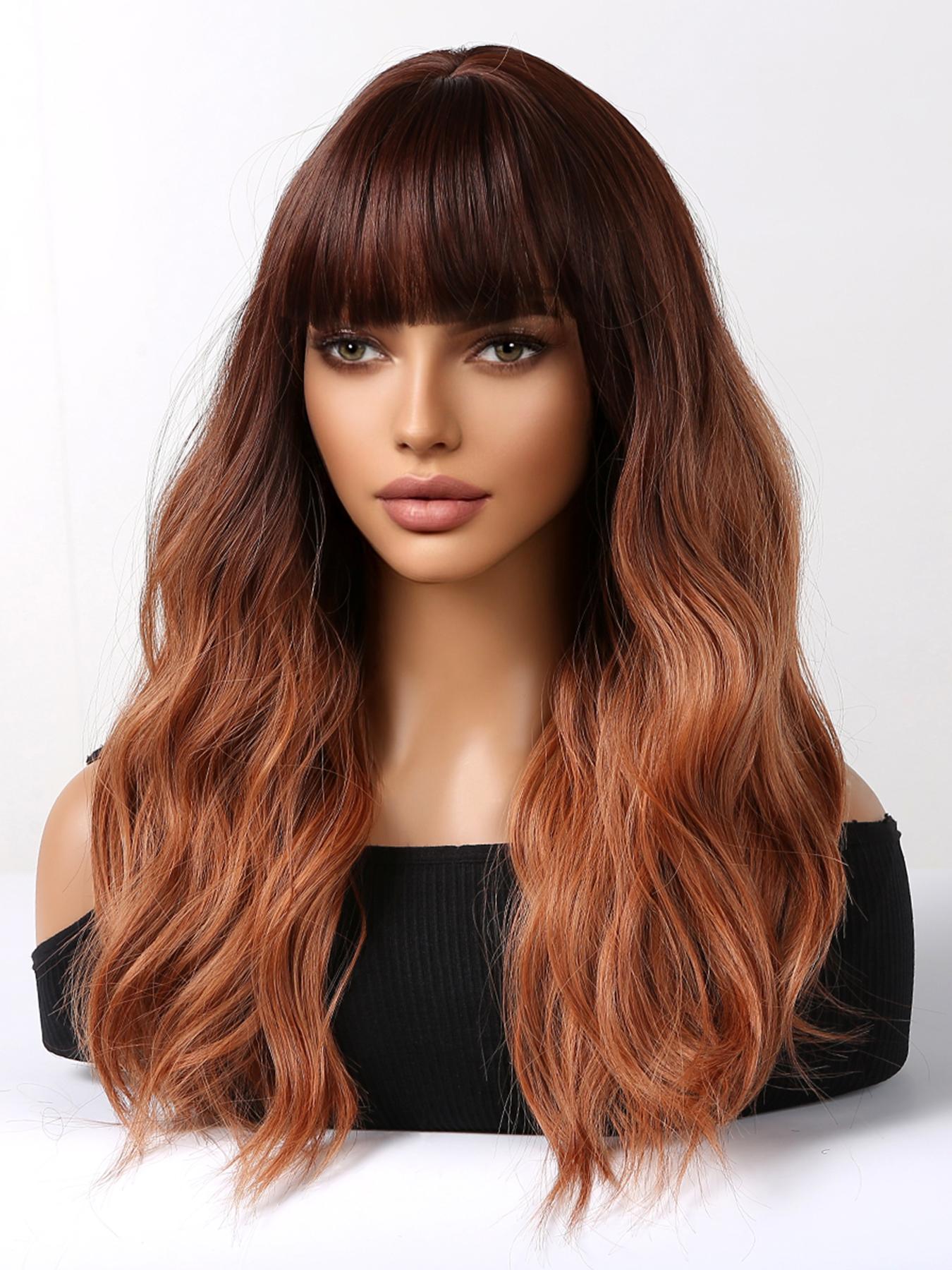 A realistic female mannequin head displays a long, wavy DWY wig with a dark brown to copper red ombre color and stylish full bangs, against a clean white background.