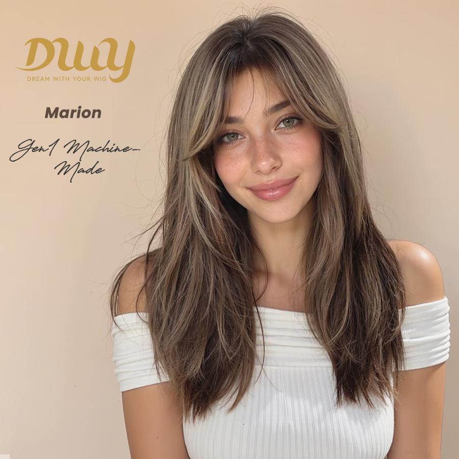 Model wearing a long, layered, light brown DWY 