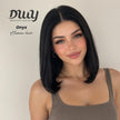 DWY Onyx human hair wig styled in a chic, blunt shoulder-length black bob, modeled by a woman in a brown tank top with a natural makeup look.