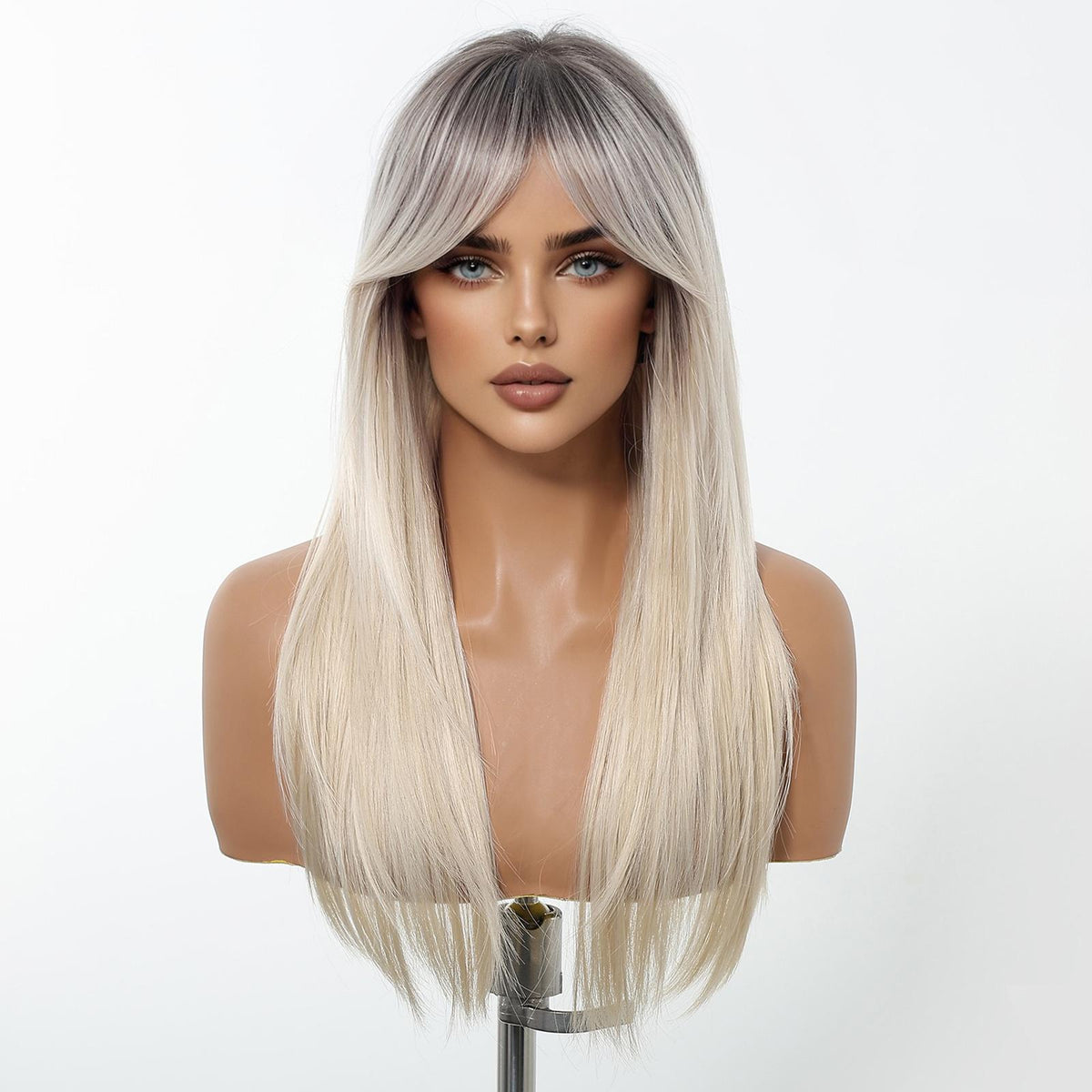 A female mannequin head displays a long, straight DWY wig featuring a trendy root-smudge effect, transitioning from dark roots to a bright platinum blonde. The wig includes full, sweeping curtain bangs.