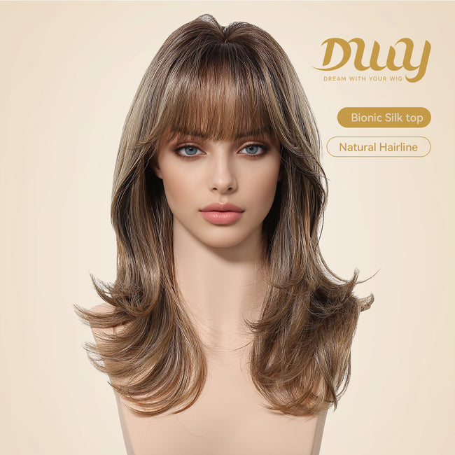 Woman wearing a shoulder-length brown layered wig with soft bangs and face-framing curls, featuring a realistic bionic silk top and natural hairline design for a seamless scalp appearance and elegant everyday style.