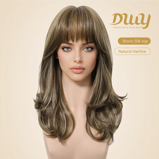 Woman wearing a medium-length brown layered wig with full bangs and soft curled ends, featuring a realistic bionic silk top and natural hairline design for a seamless scalp appearance and elegant everyday hairstyle.
