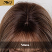A detailed close-up view of the parting line and roots of a DWY brand synthetic wig, showing a realistic scalp effect. The hair is a multi-tonal brown with subtle highlights and features a straight fringe. The gold DWY logo is visible at the top left, and the product name 「Blake」 is at the bottom.
