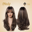 Front and back views of a mannequin head showcasing the DWY long layered brown and blonde synthetic wig with bangs, presented against a light beige background.
