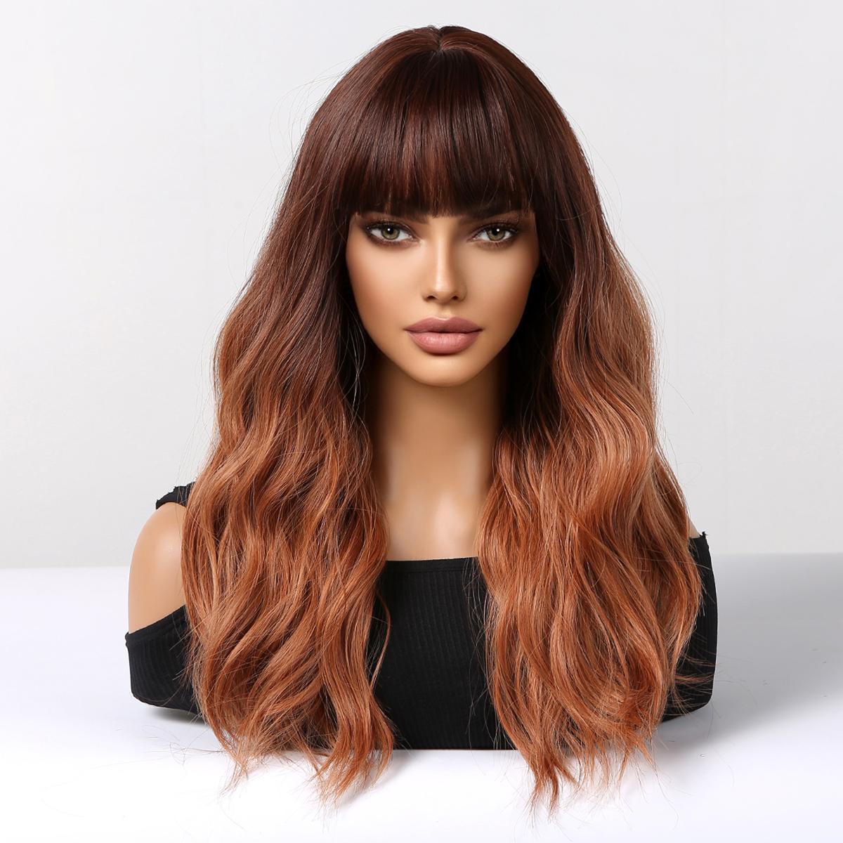 A realistic female mannequin head displays a long, wavy DWY wig with a dark brown to copper red ombre color and stylish full bangs, against a clean white background.
