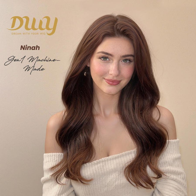 DWY Ninah machine-made wig features long, wavy, dark brown hair with subtle lighter tips, modeled by a woman in a white off-shoulder top.