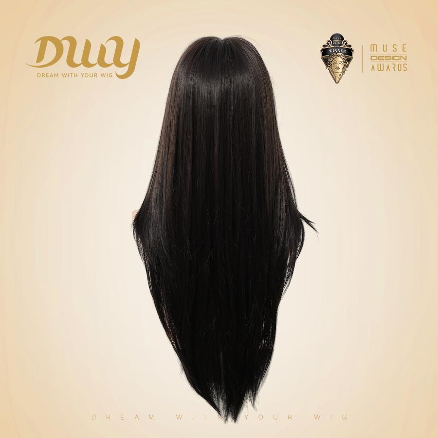 A back view photograph of a long, dark brown wig displayed on a mannequin head. The wig features a distinct 