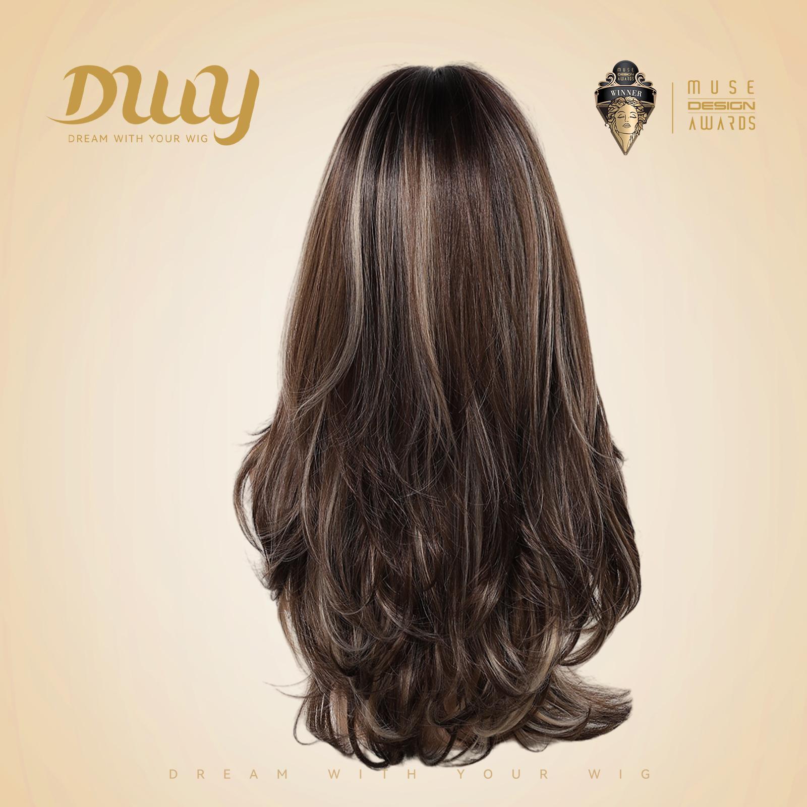 Back view of a mannequin head showcasing the DWY long layered synthetic wig in brown and blonde highlights, set against a beige studio backdrop with a logo badge.