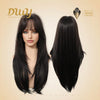 A product showcase image against a soft beige background, featuring two views of the same long, dark brown layered wig with wispy bangs. On the left, a realistic female mannequin head models the front, showing the layered cut and fringe. On the right, the wig's back view is shown on an invisible form, highlighting the length and subtle V-shape. Gold logos for 