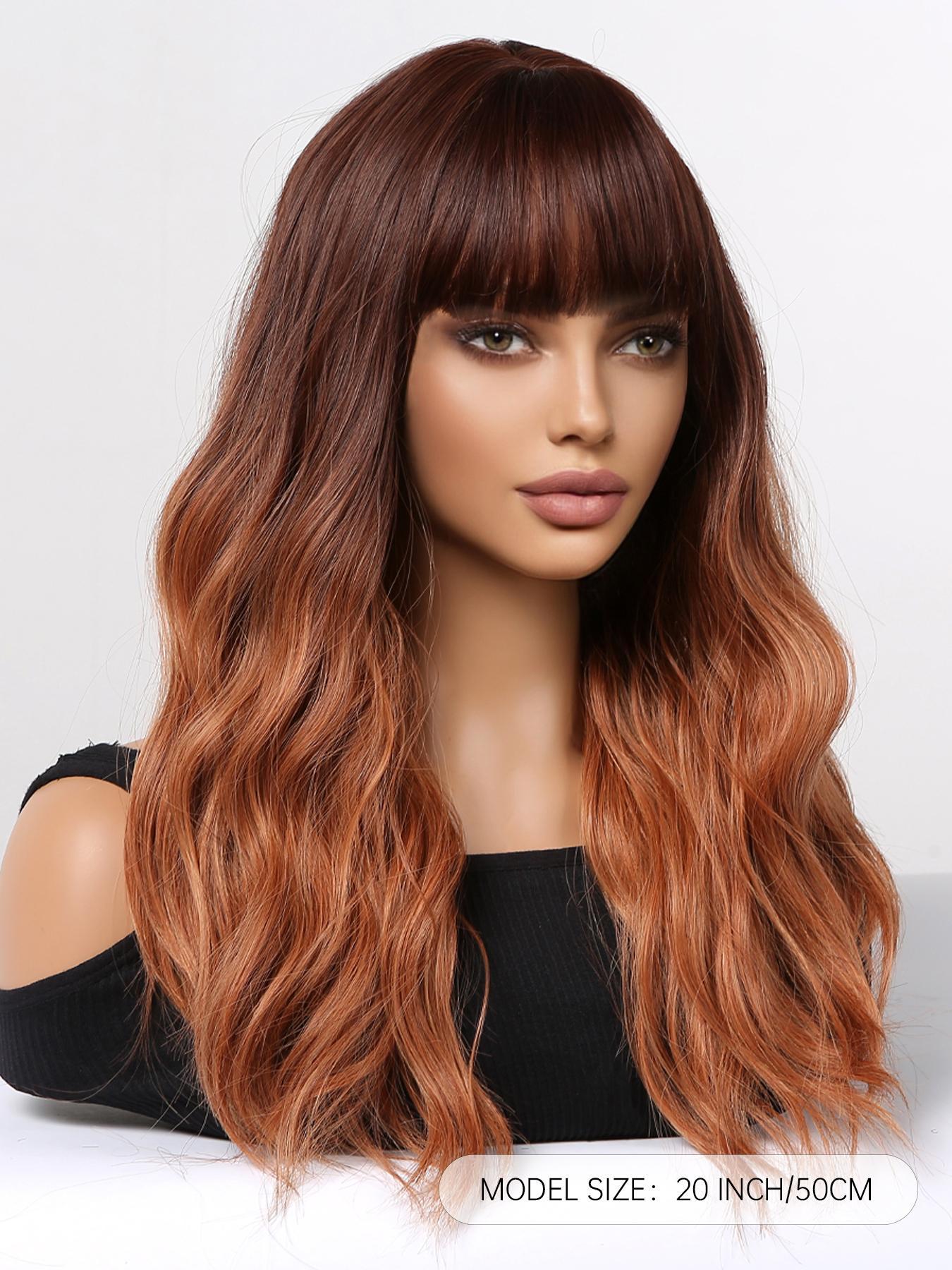 A realistic female mannequin head displays a long, wavy DWY wig with a dark brown to copper red ombre color gradient and stylish full bangs, against a clean white background with product size text.