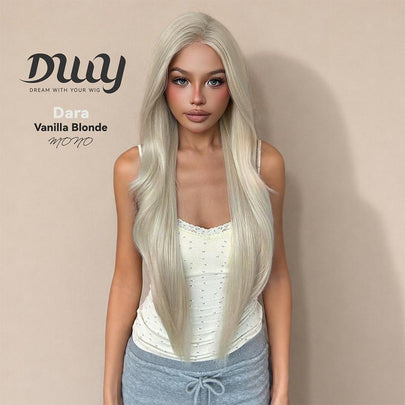 A woman models the DWY 'Dara' wig in a 'Vanilla Blonde' shade, featuring a monofilament part. This long, straight, light blonde hairpiece has subtle layering and a natural appearance. The model wears a cream lace-trimmed tank top and grey sweatpants. The background is a simple, solid beige wall with text overlay. There is a blue button on the chest of the model.